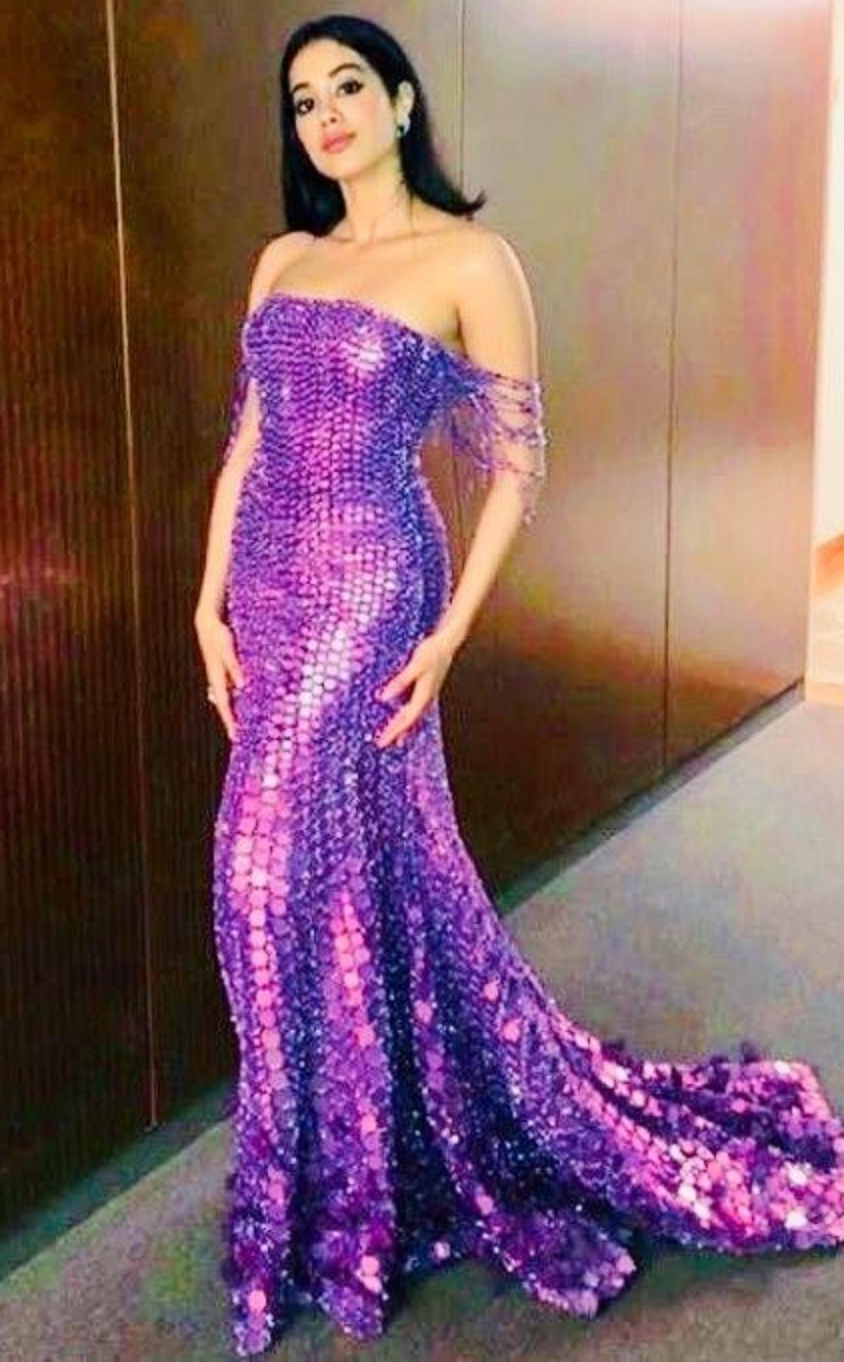 Jahnvi Kapoor looks like a purple mermaid in this off-shoulder gown with a small trail at the back. Janhvi's gorgeous purple party gown was designed by Bollywood's ace fashion designer Manish Malhotra. 