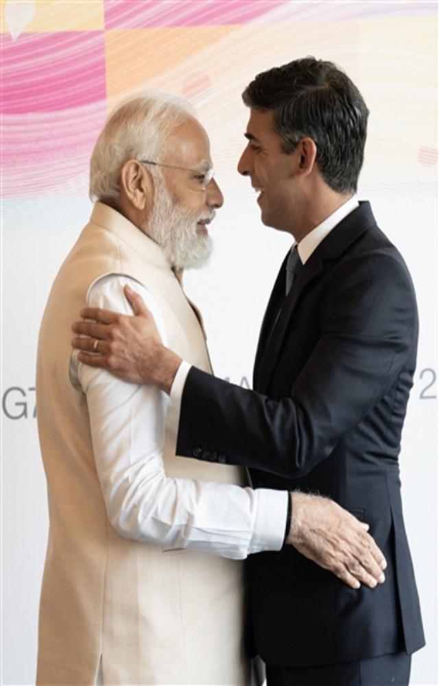G7: PM Modi meets British counterpart