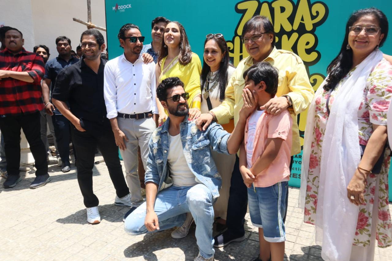 Vicky Kaushal and Sara Ali Khan pose with their onscreen family at the trailer launch event