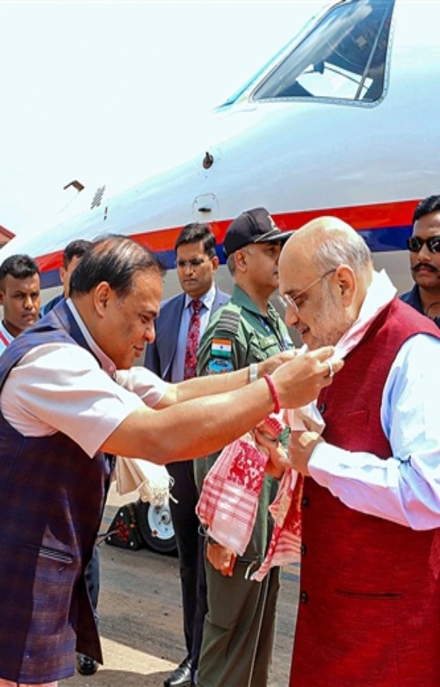 Union Home Minister Amit Shah being welcomed by Assam Chief Minister Himanta Biswa Sarma on his arrival, in Guwahati, Thursday, May 25, 2023