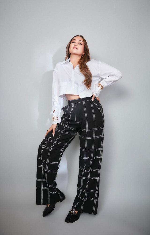 Sonakshi Sinha is sporting a stylish trousers and crop shirt ensemble.