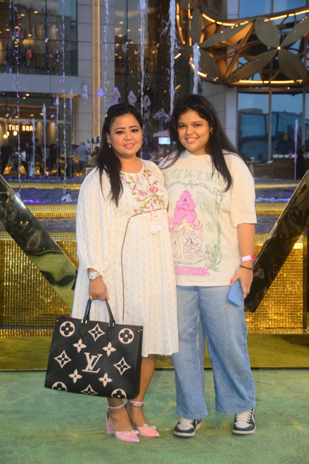 Bharti Singh was seen in a white outfit as she arrived with a family member