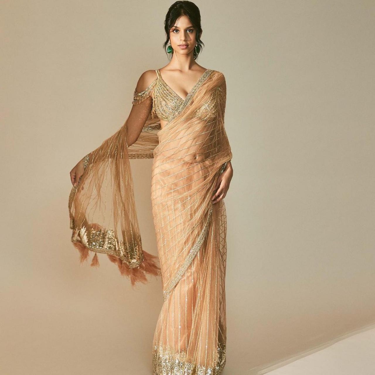 Slipping into a beautfiul beige saree with sequined embroidery, Suhana shines in her ethnic look! 