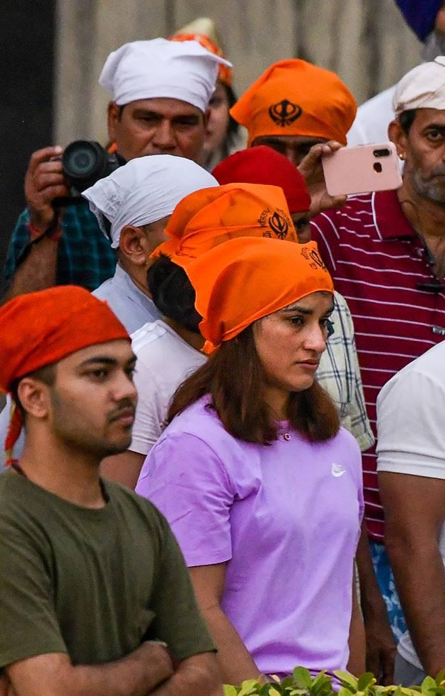 Wrestler Vinesh Phogat with supporters at Gurudwara Bangla Sahib during their protest march.