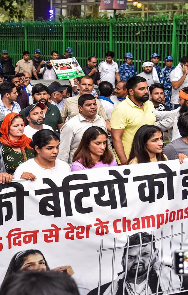 Wrestlers Bajrang Punia, Vinesh Phogat, Sakshi Malik and Sangita Phogat with supporters during their march towards Gurudwara Bangla Sahib.