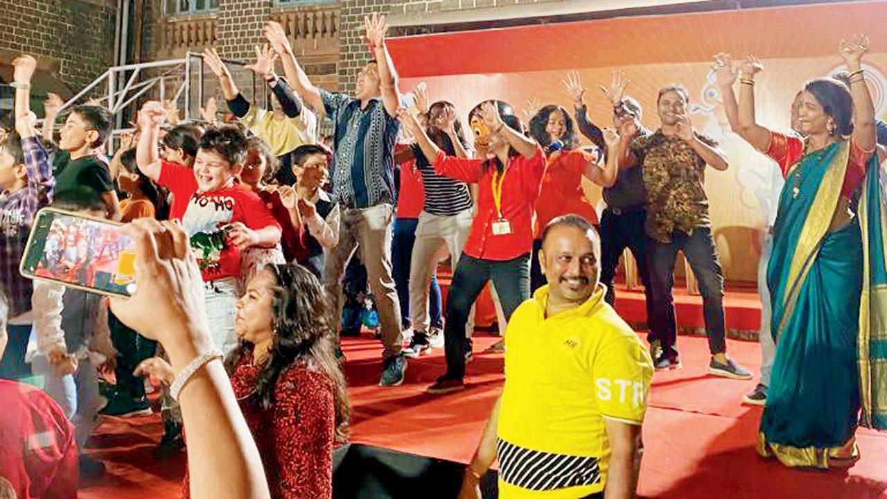 Children perform alongside teachers at an earlier fest on the campus