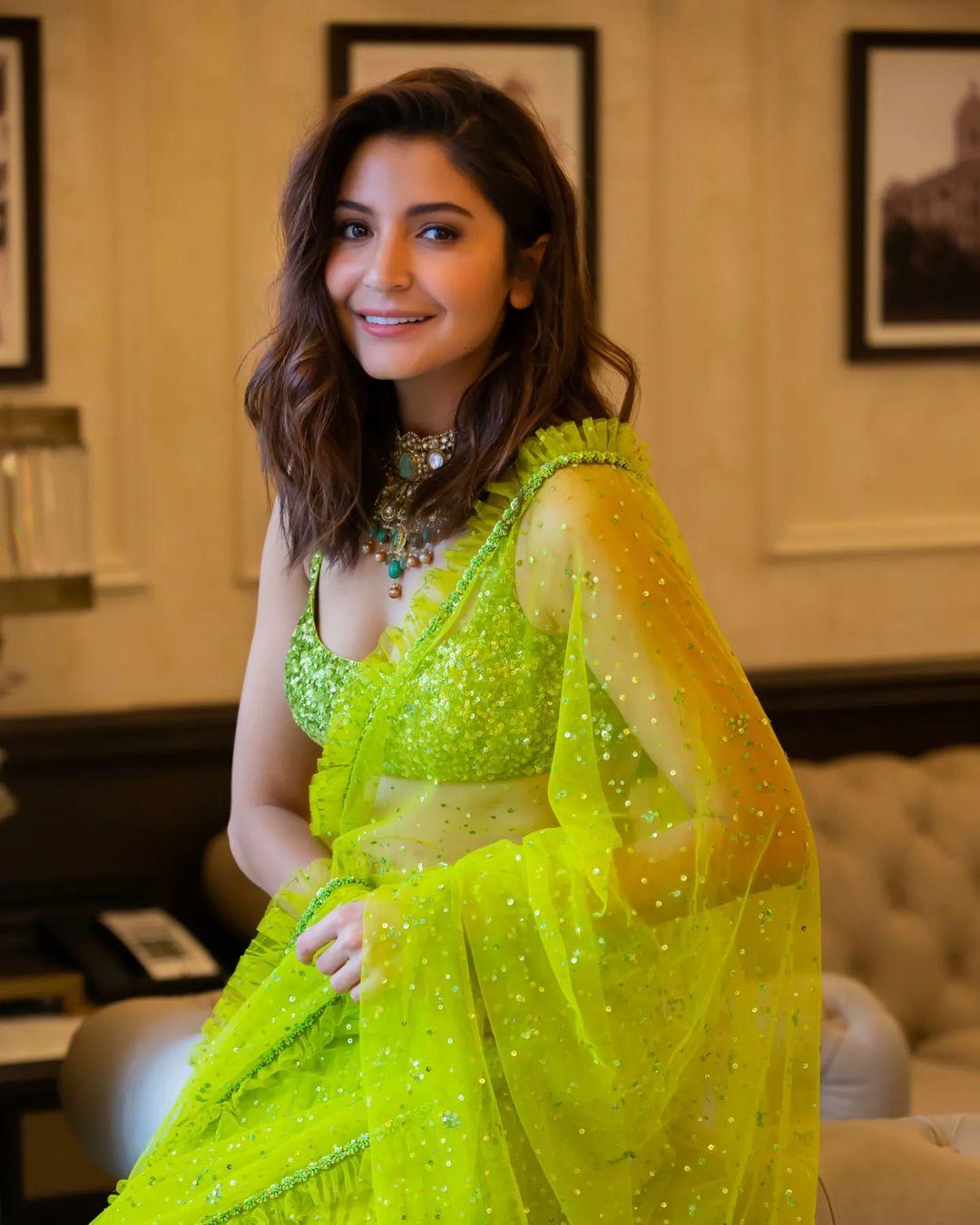 Anushka left her hair open and opted for an intricate necklace, ditching earrings to complete her look