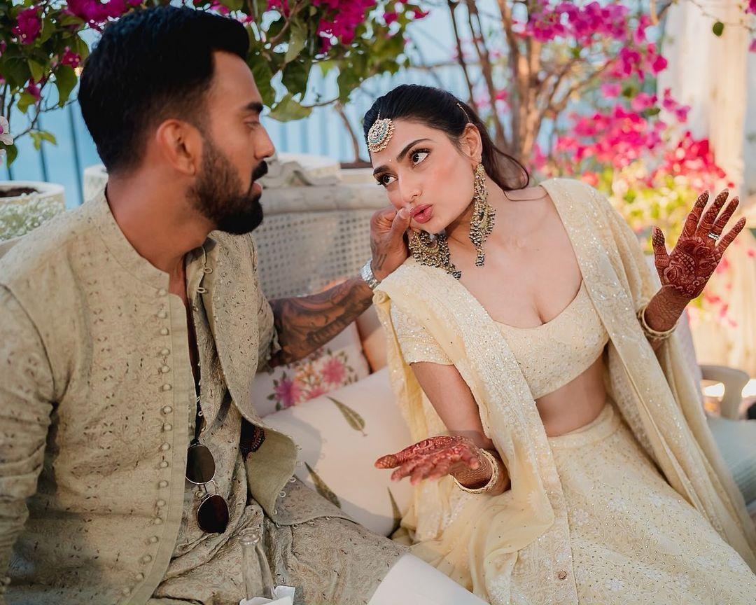 This adorable photo is from the couple's intimate mehendi ceremony. In this picture, Athiya is making a silly face while KL Rahul playfully pinches her cheek