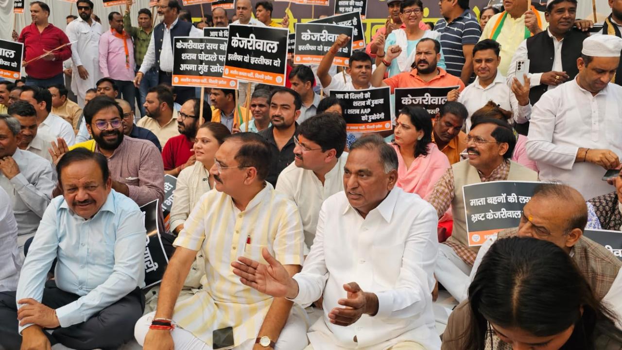 Delhi BJP leaders organised a protest near Rajghat, the Mahatma Gandhi memorial wherein they demanded the resignation of Chief Minister Arvind Kejriwal. Pics/PTI & X
