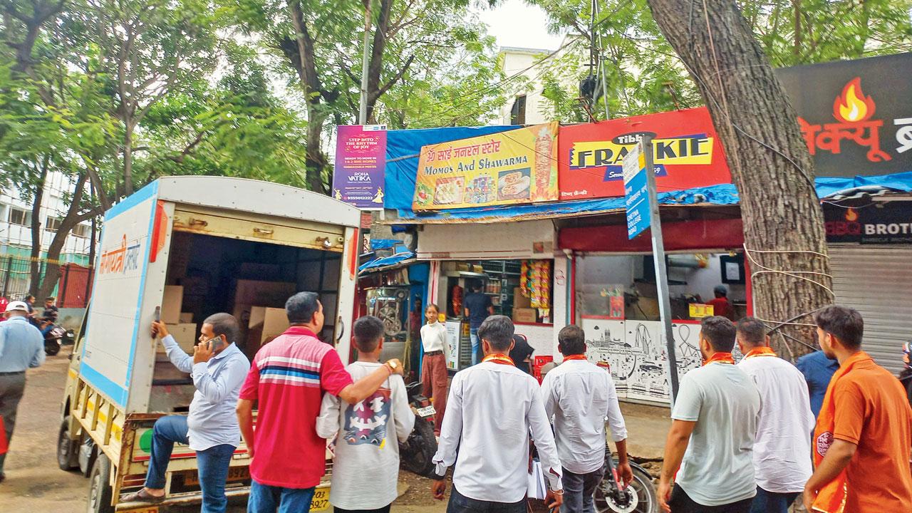 MNS workers visit non-complying shops in Bandra East on Monday