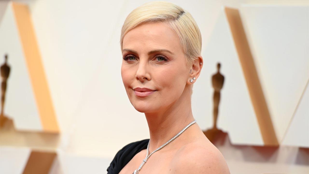 Charlize Theron reveals how Taylor Swift helped her become a 'hero' to her kids
