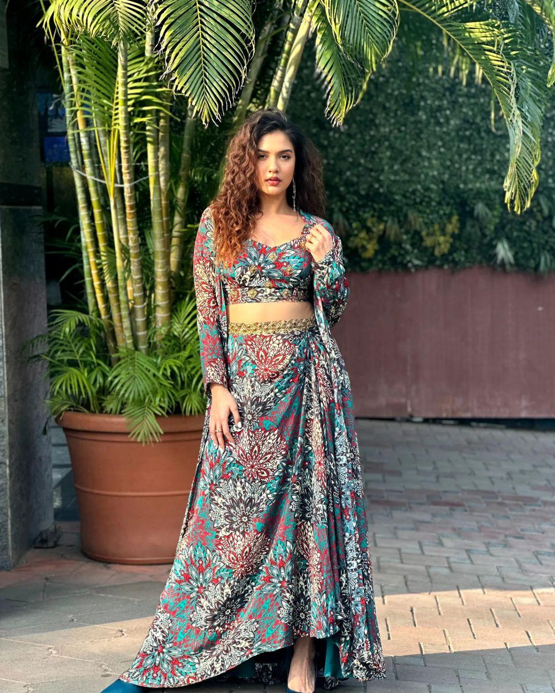 Divya donned this beautiful multicolour co-ord skirt set and added curls to her hair, which makes her look ravishing