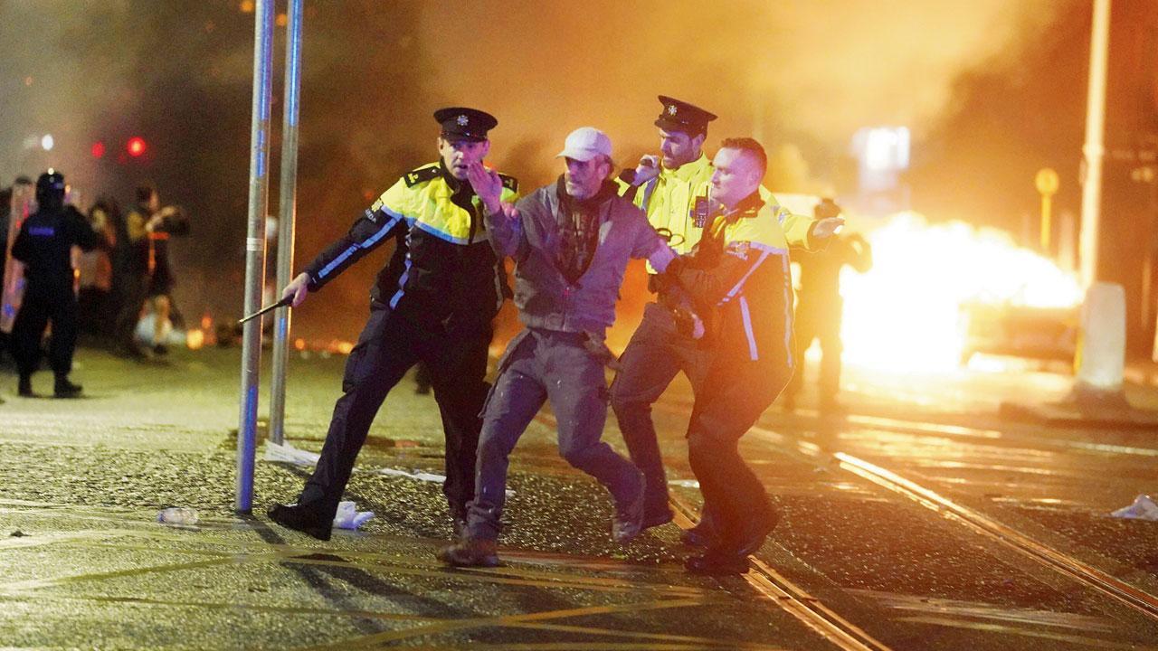 Violent clashes break out in Dublin after knife attacker injures children