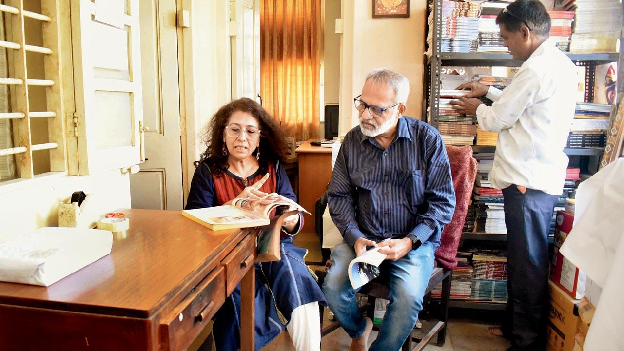 Editor of Akshar, Meena Karnik adds final touches to the latest edition with colleagues at her Dadar residence. The ank hit the stands this weekend. Pic/Sameer Markande