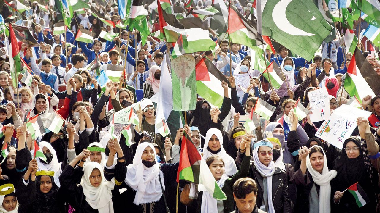 Pakistani women and children take part in a rally against Israel. Pics/AP