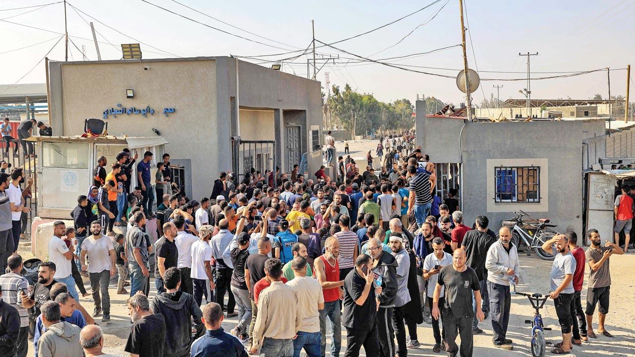 Palestinian workers stranded in Israel cross back into the Gaza Strip