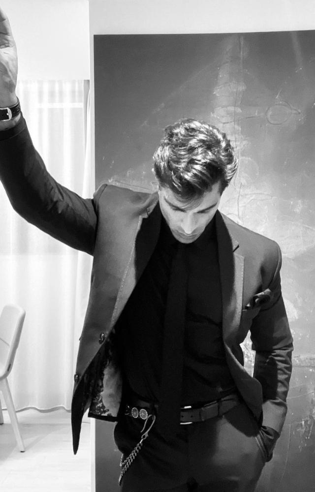 Karan, a master of styling, sizzled in a hot black three-piece suit, exuding undeniable charisma