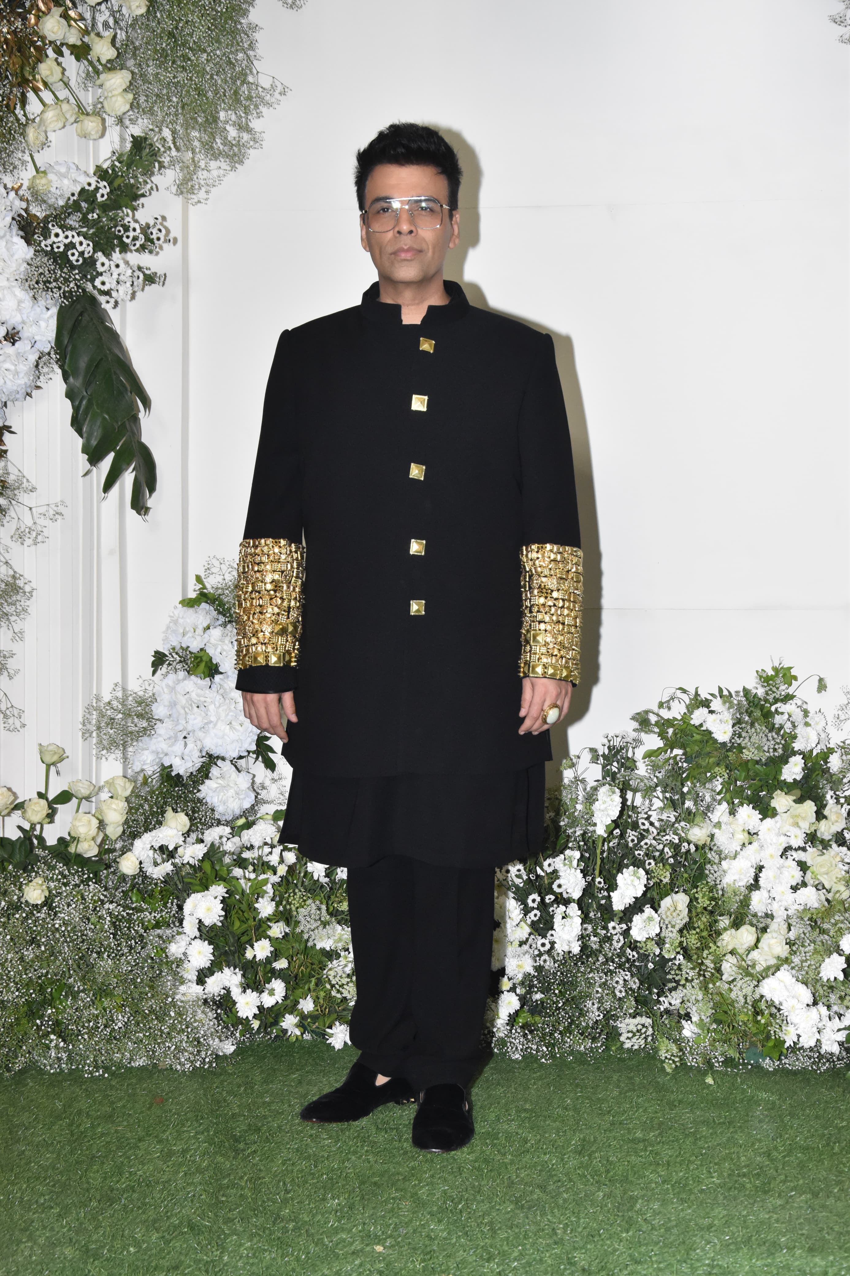 Ace director Karan Johar attended the party wearing a sherwani suit adorned with intricate golden embroidery on the sleeves