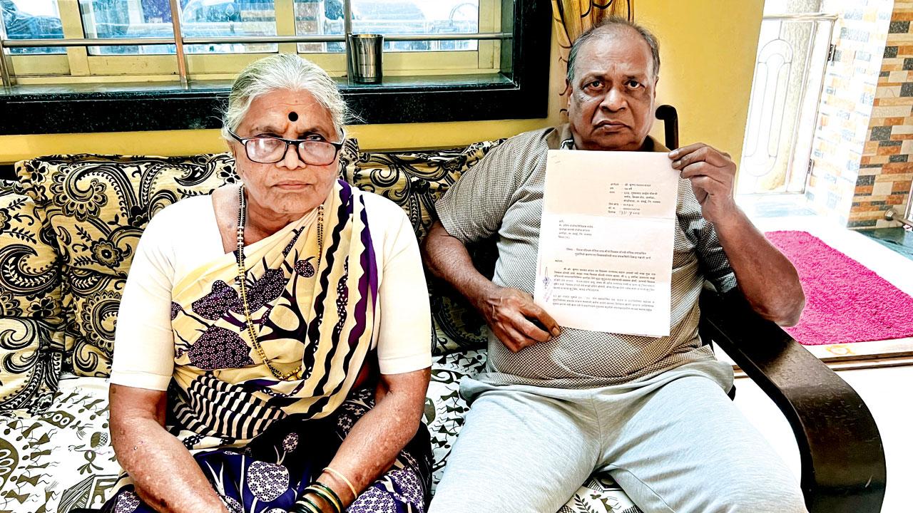 Krishna and Prema Raut holding the copy of the written complaint he filed with the police. Pics/Hanif Patel