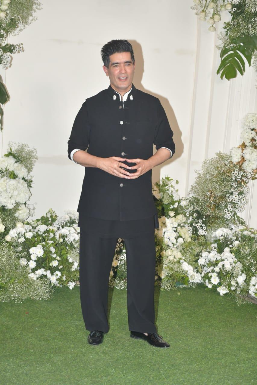 Designer Manish Malhotra, who hosted the first grand Diwali bash of the year, posed for the paparazzi in a black Nehru Jacket paired with matching pants