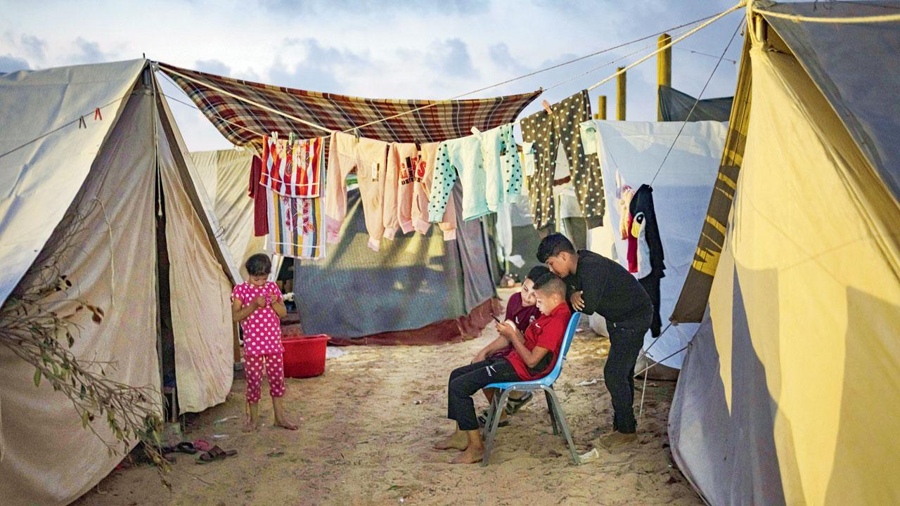 Displaced Palestinian kids at a tent camp in Khan Younis. Pics/AP
