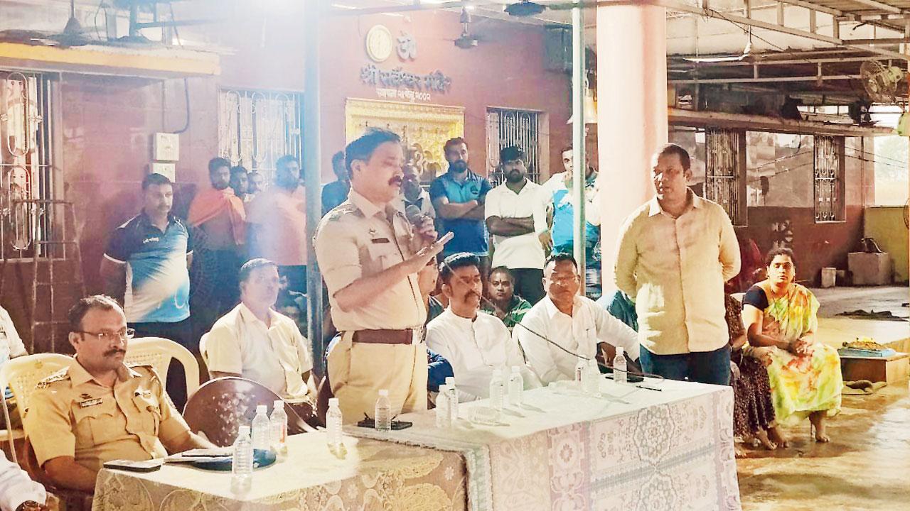 Villagers attend the meeting organised by the police and the politicians