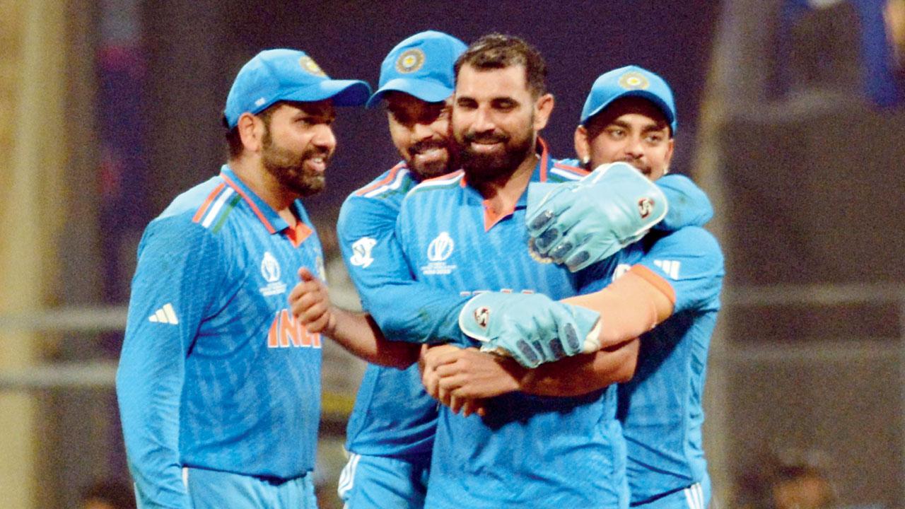 KL Rahul hugs India pacer Mohammed Shami who took 7-57 yesterday