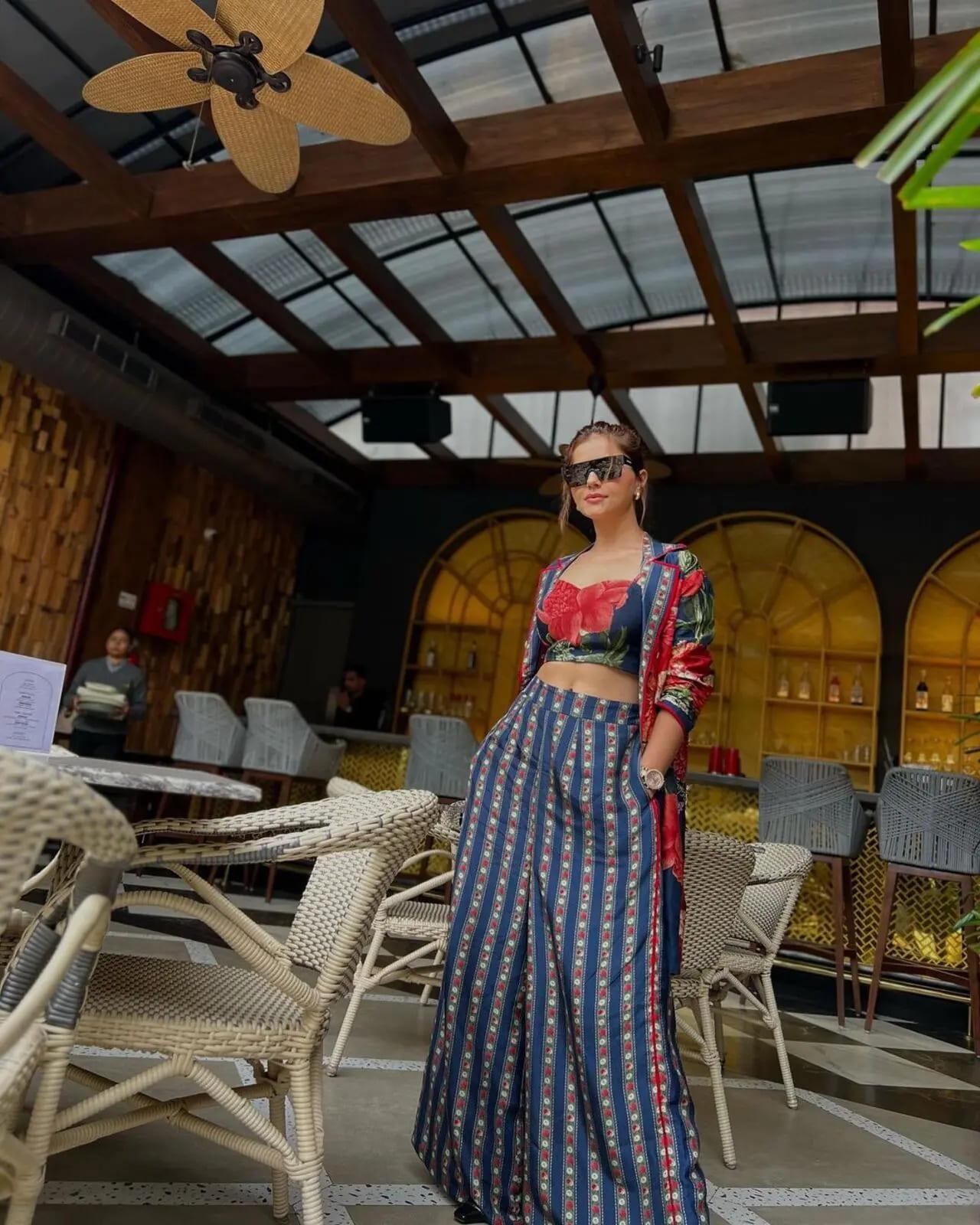 Rubina exuded style in a printed crop top and matching coat, perfectly complemented by printed bottoms
