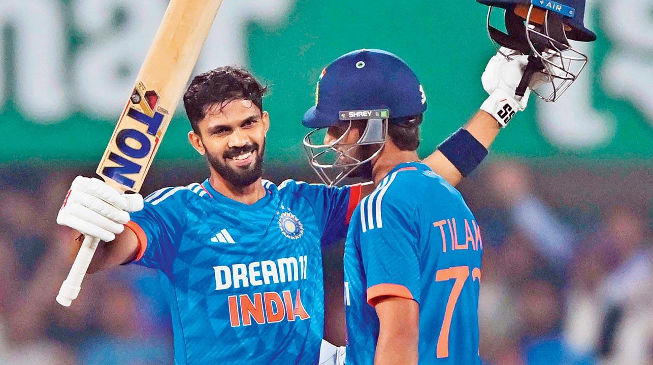 India’s Ruturaj Gaikwad (left) celebrates his century against Australia with teammate Tilak Varma in Guwahati yesterday. Pic/AFP