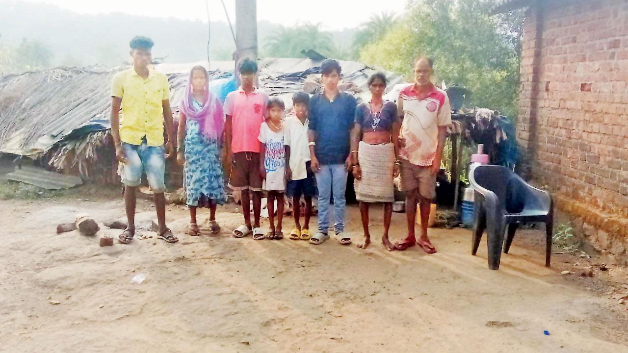 The youth and one of the 12 tribals who worked on Sundardas Kesarkar’s plot the 19-year-old and his relatives. Pics/Hanif Patel