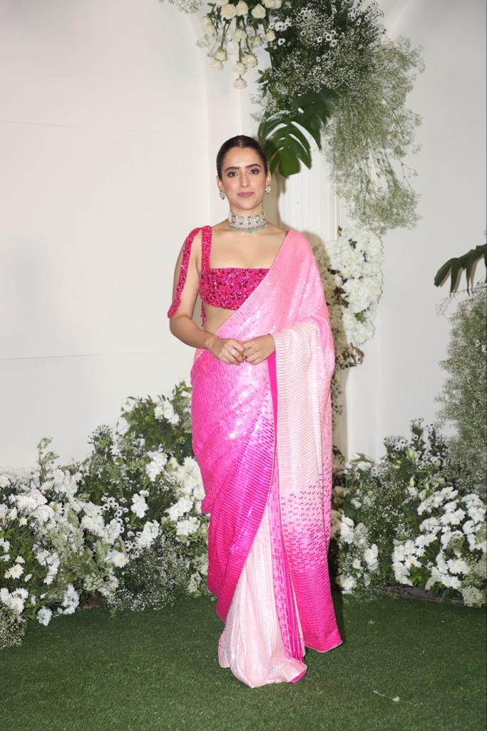 Jawan actress Sanya Malhotra attended the party in a pretty pink and white saree. The actress tied her hair in a chic bun and wore an intricate necklace to complete her look