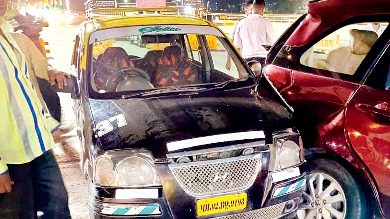 Innova car next to a taxi that it had hit