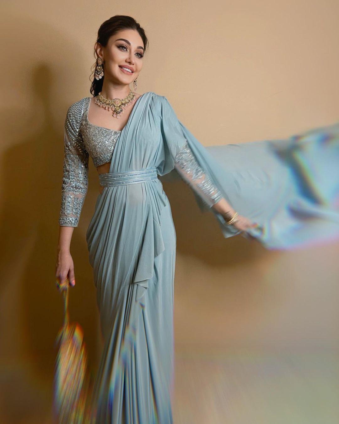 Shefali continues to set fashion standards with her mesmerizing saree look. The heavily embroidered saree, adorned with intricate matching belt, is truly amazing