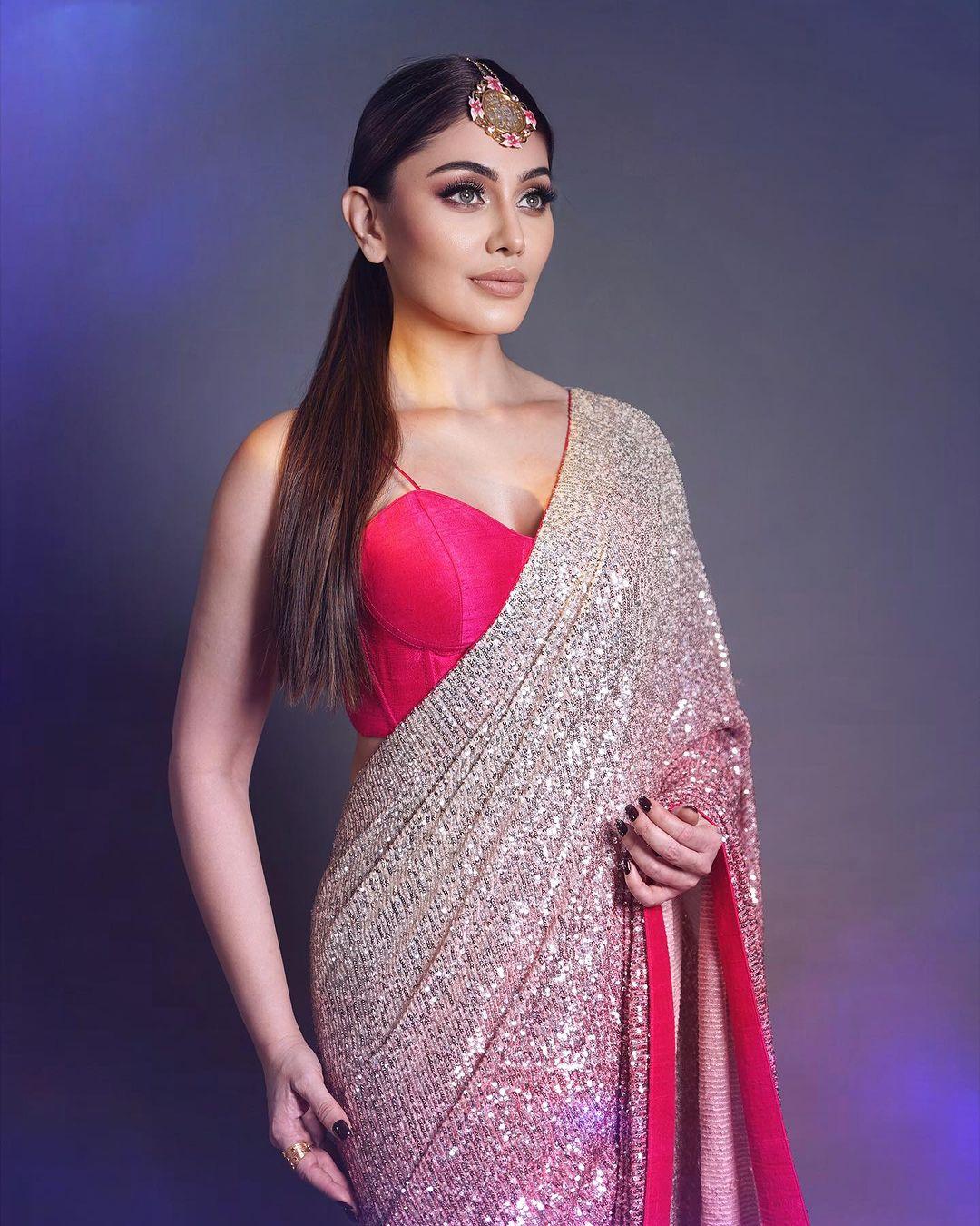 For a lightweight yet stylish look at your relative's wedding, take inspiration from Shefali's elegant choice. Opt for a beautiful pink sequin saree paired with a matching blouse