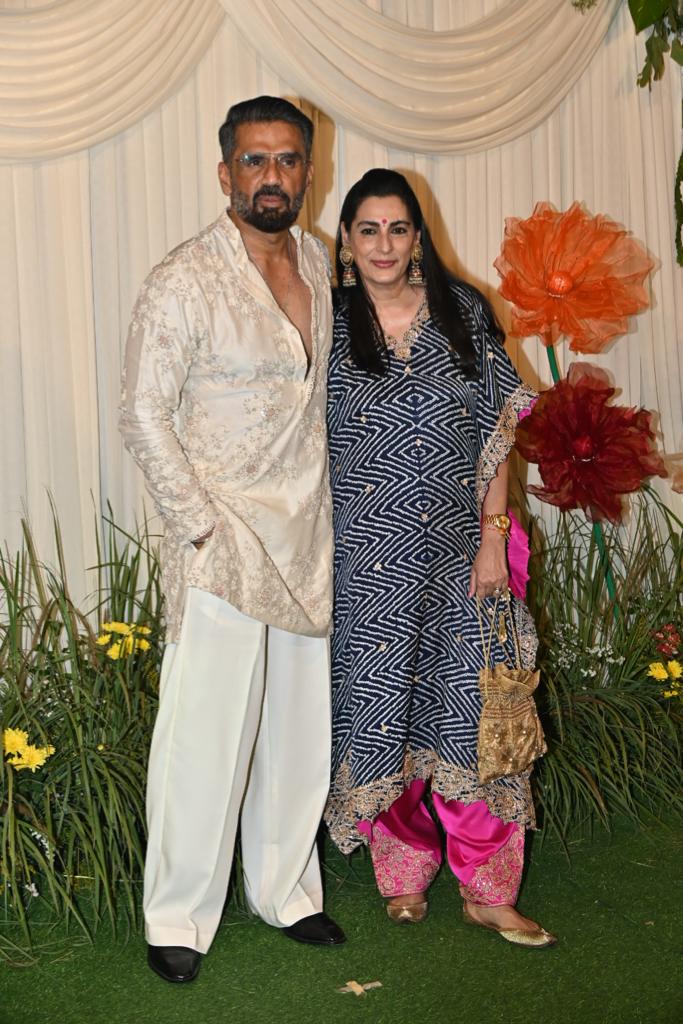Suniel Shetty posed for the paparazzi as he attended the celebration with his wife