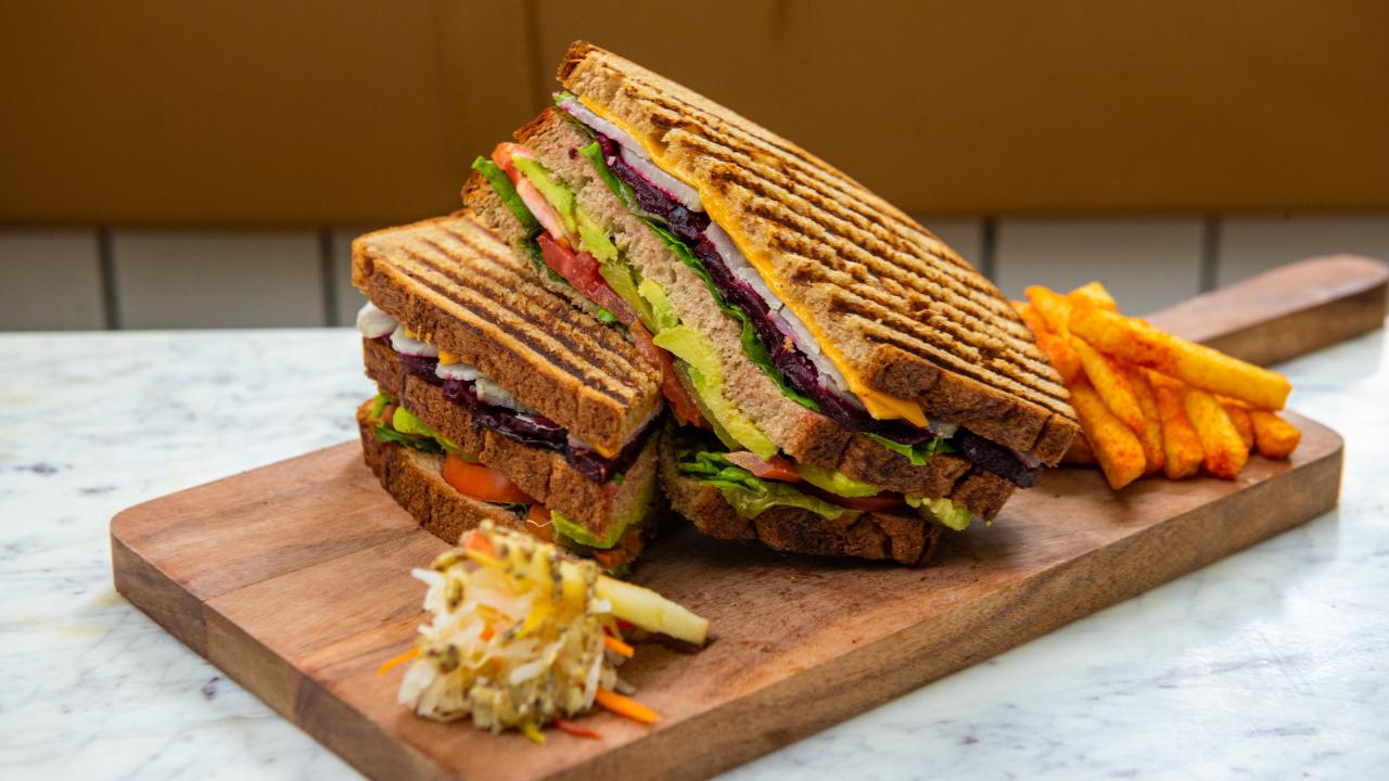 At Smoke House Deli, chef Rollin Lasrado took inspiration from the Mumbai sandwich to recreate the SHD Veg Club Sandwich, with layers of Coorgi avocado guac, sweet potatoes and beets, spiced grilled tomatoes, caramelised onions and cheese in whole wheat bread.