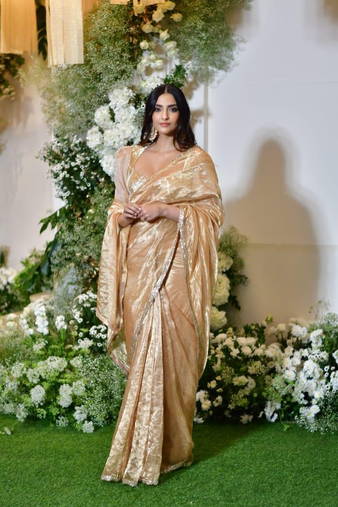 Fashion icon Sonam Kapoor attended the event in a stunning golden saree. Her hair was left loose, and she kept her jewellery minimal, completing her look with a pretty earring