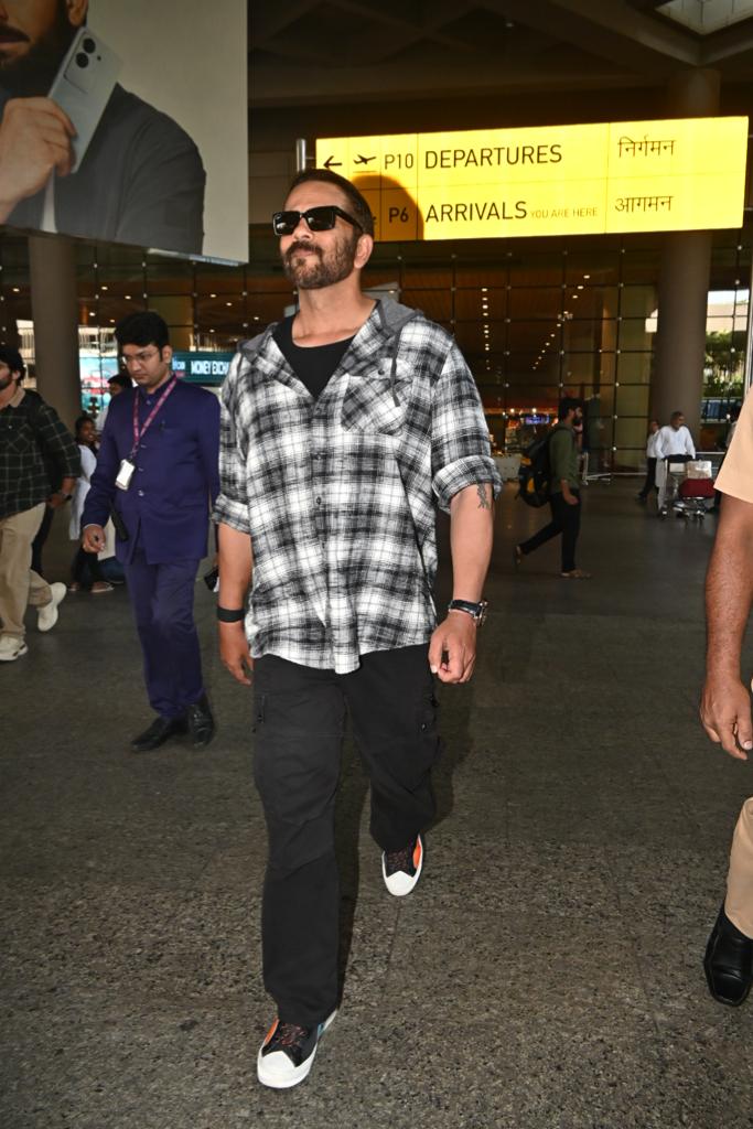 Rohit Shetty wore a smart checkered shirt and comfy trousers for his airport look 