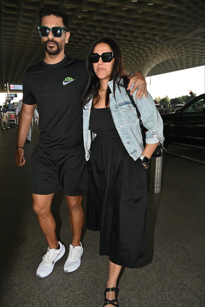 Neha Dhupia and Angad Bedi posed for the paparazzi as they were spotted in the city