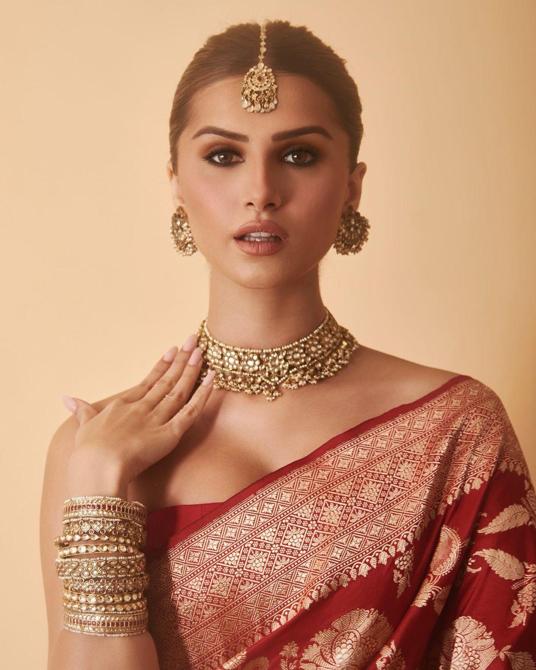 This red saree is while traditional had a modern twist with a strapless blouse