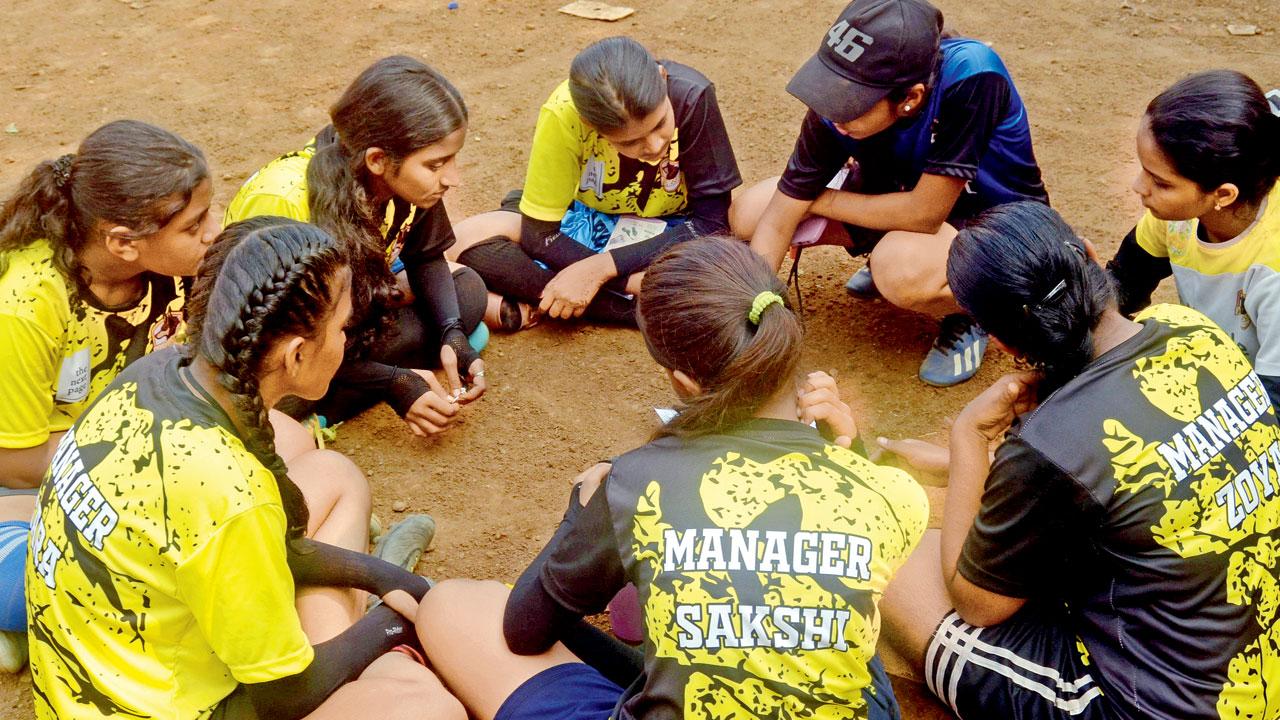 Girls discuss their game plan