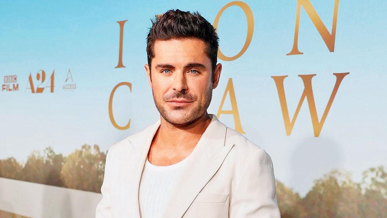 Zac Efron is upbeat as he promotes his new wrestling movie, The Iron Claw