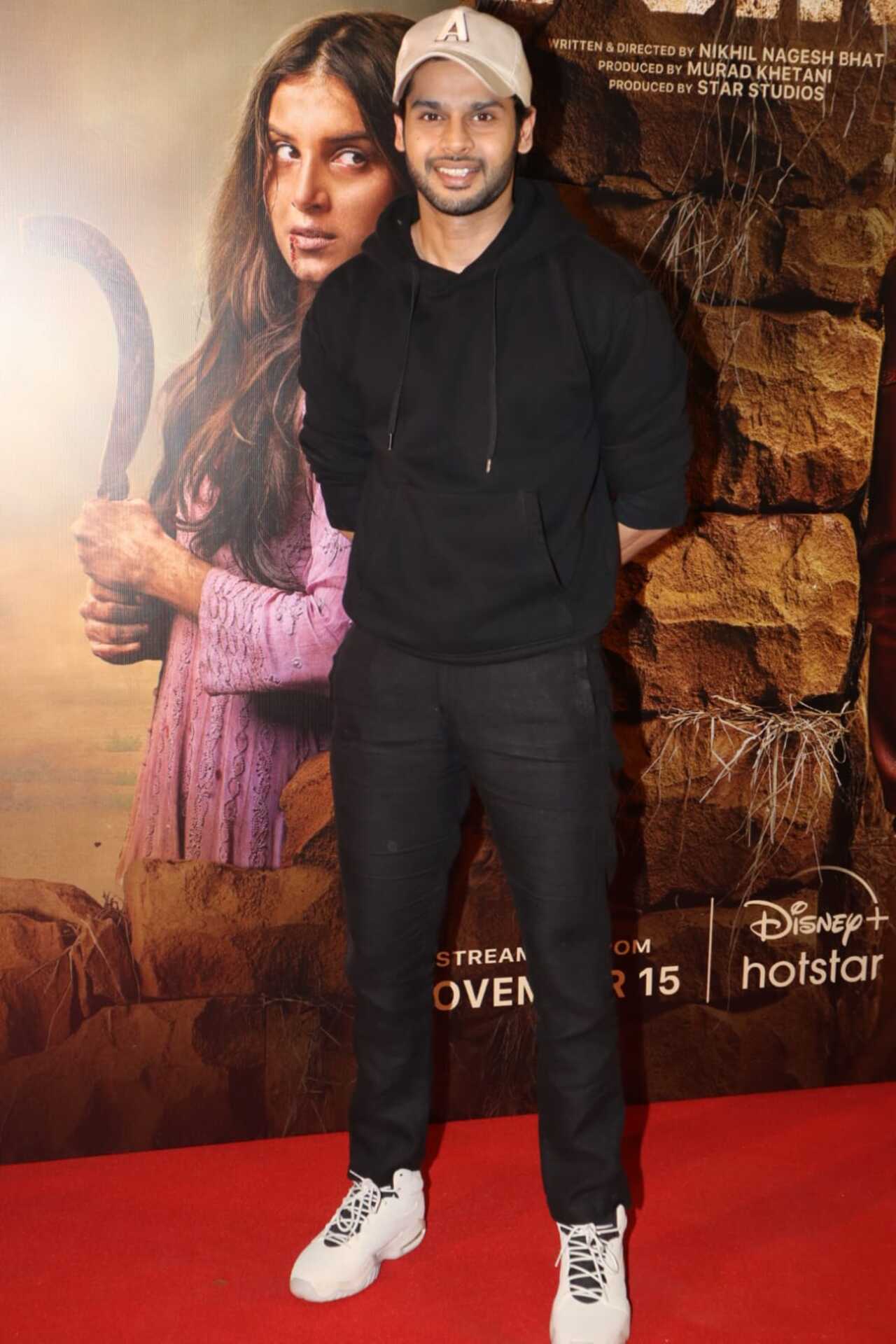 Abhimanyu Dassani flashed a smile for the paparazzi as he arrived in casual wear for the screening