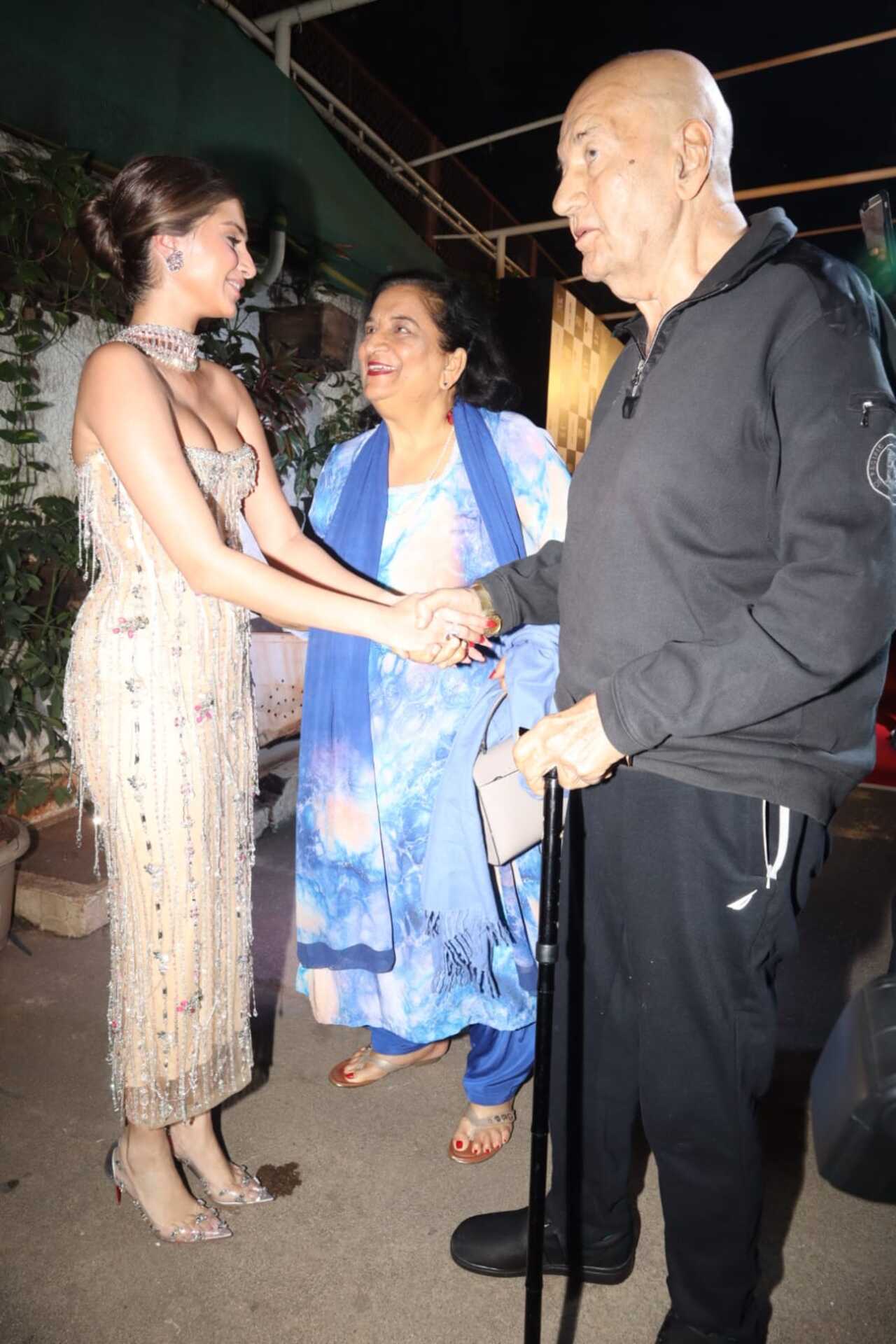Tara Sutaria greets Prem Chopra at the screening of her film