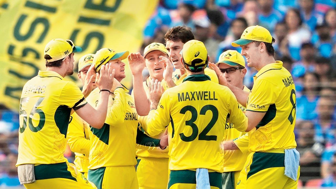 Australia skipper Pat Cummins (4th from right) celebrates the dismissal of Virat Kohli with teammates at Ahmedabad on Sunday. Pic/PTI