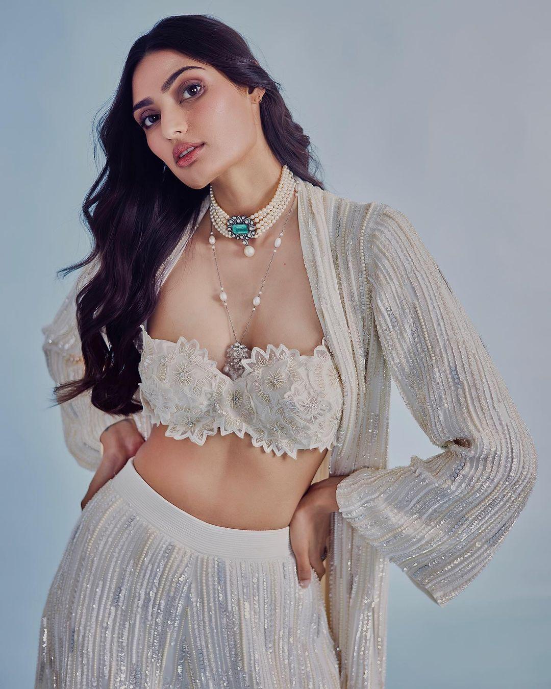Athiya Shetty appeared gorgeous in a beautiful outfit by Manish Malhotra. She wore a three-piece set in ivory, consisting of a bustier with delicate 3D floral embroidery. 