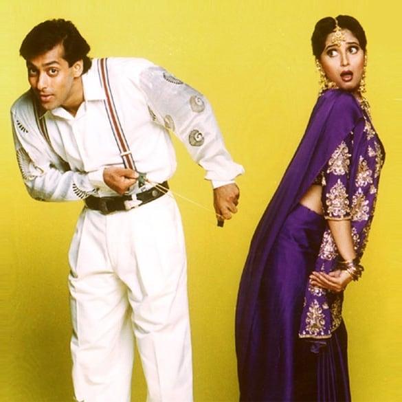 Hum Aapke Hain Koun: Need we say any more? Madhuri Dxit's pruple saree was ahead of its time in terms of the way it was styled. The long-sleeved blouse had golden embellishments on the neck that matched seamlessly with the otherwise 'plain' saree, which had a matching border. The outfit is one of the major go-tos even today.