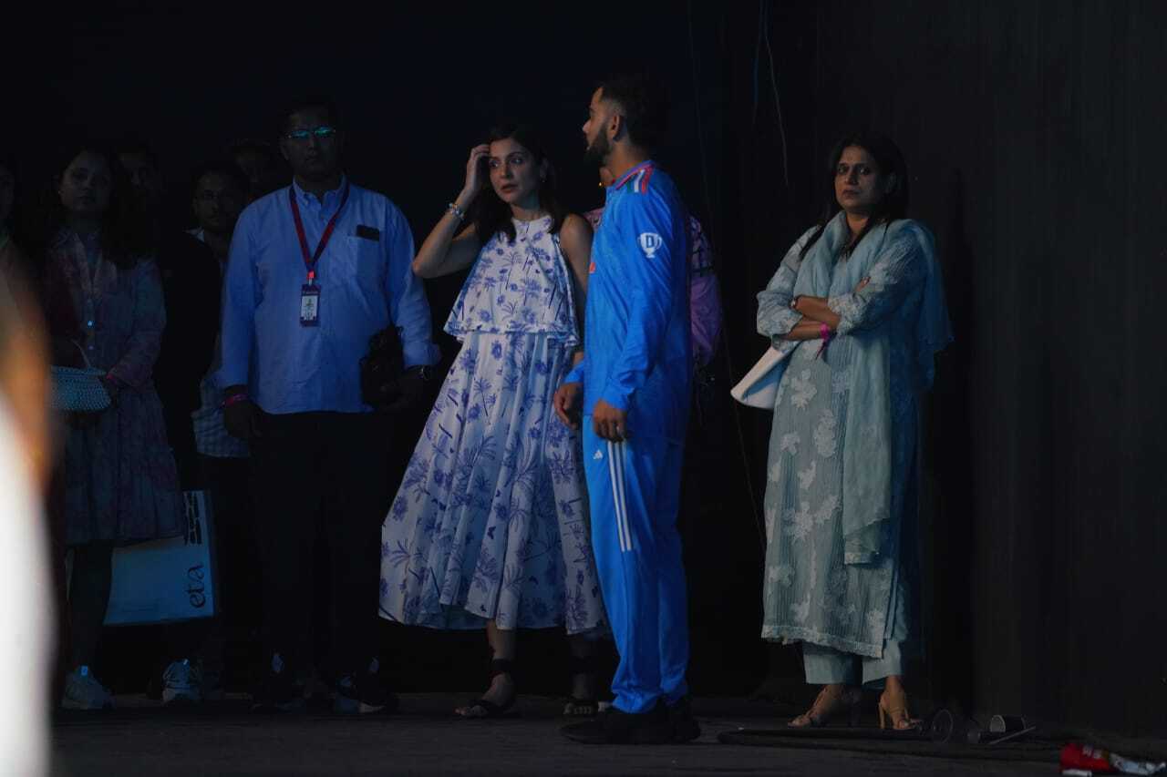 Anushka holds Virat's hand post the match, consoling her heartbroken husband