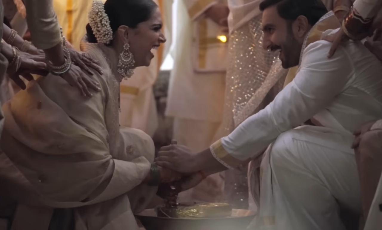 Ranveer and Deepika participated in a fun post-wedding ritual. Dressed in ivory, the couple seemed delighted and happy