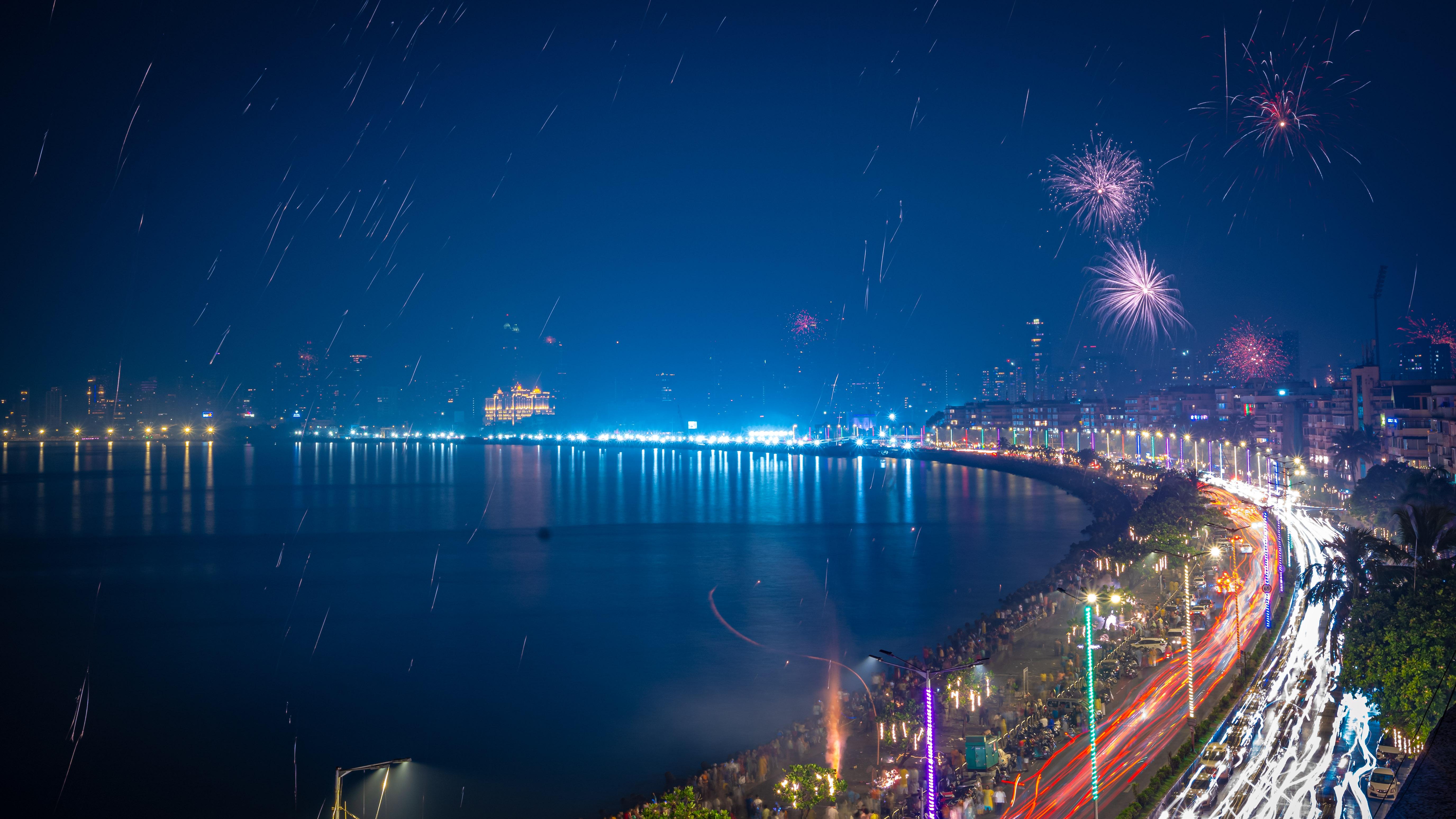 The skyline becomes a canvas of festive brilliance, drawing crowds to witness the breathtaking display.